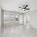 Photo of Aventon Soraya's living area with ceiling fan and lots of natural lighting
